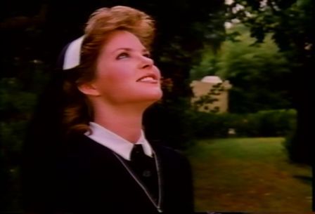 Melissa Sue Anderson as Elizabeth looking towards the heavens after seeing the miracle again